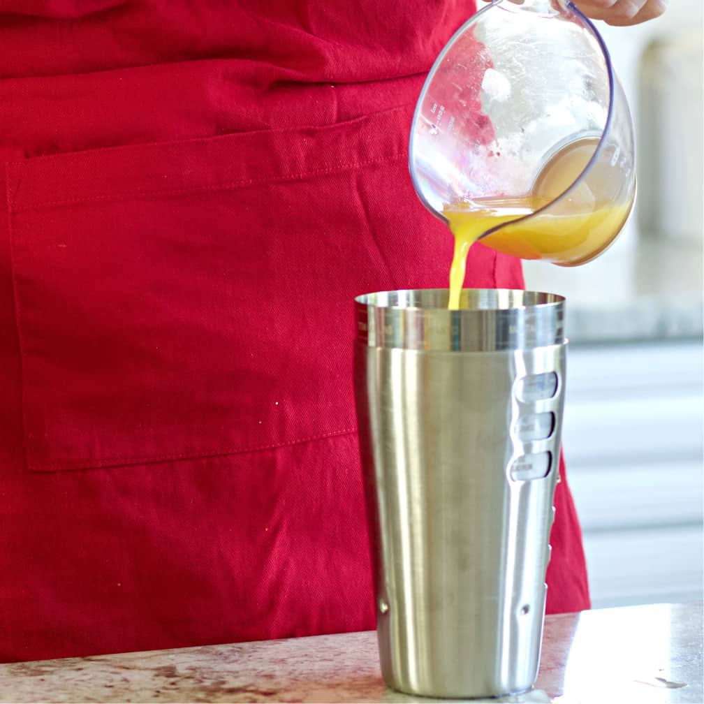 pour in the orange juice-rum punch
