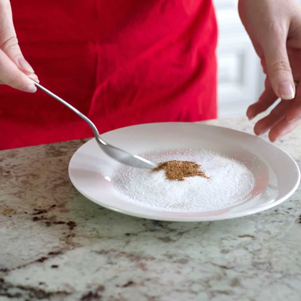 mix sugar and pumpkin spice on a second small flat plate