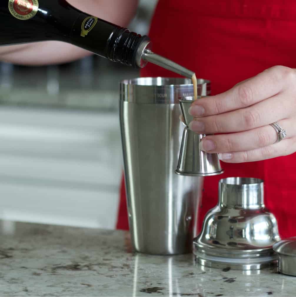 Pouring the pumpkin spice liqueur