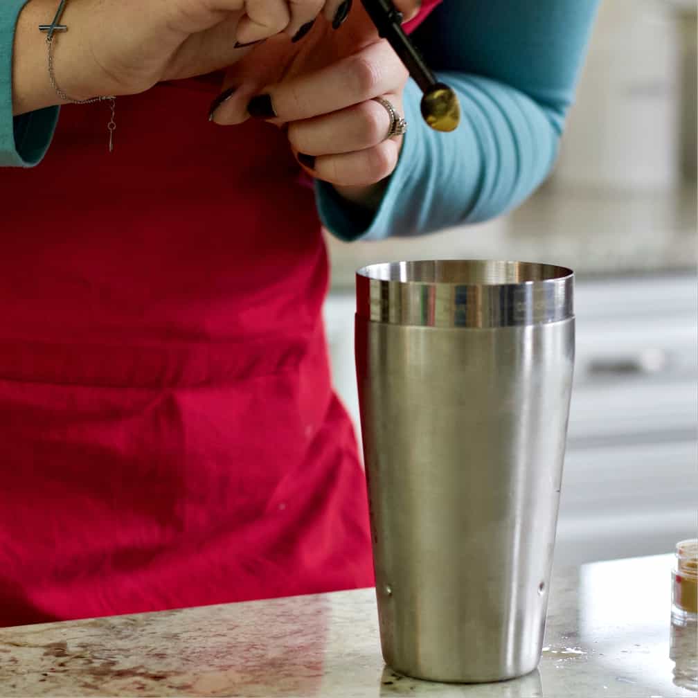 add the glittery luster powder to the cocktail shaker