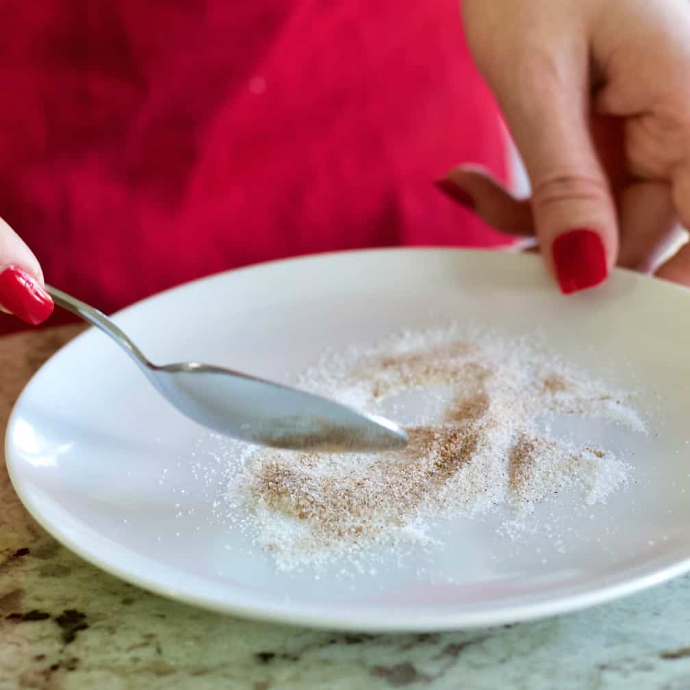 mixing sugar and pumpkin pie spice