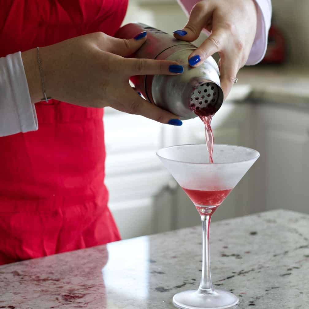 pouring the washington apple into a martini glass