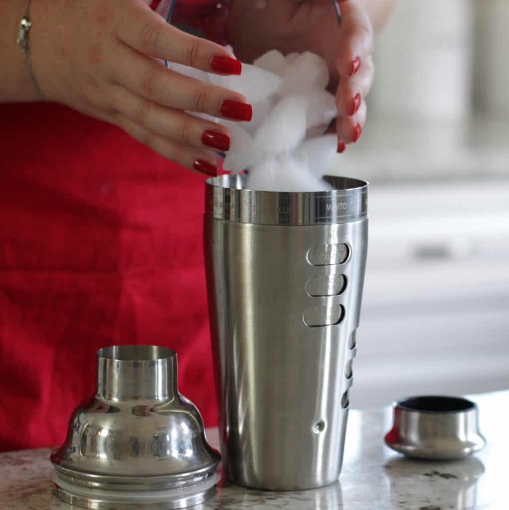 adding ice to your cocktail shaker