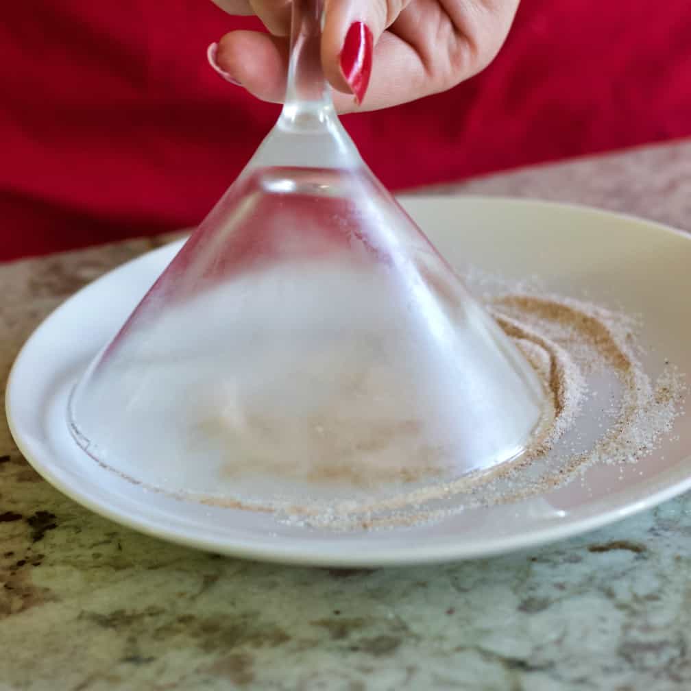 swirl the glass through the sugar and spice for a rimmed pumpkin Spice Martini Thanksgiving Cocktail