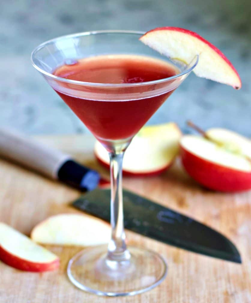 slices of apples on a wooden cutting board with the washington apple 