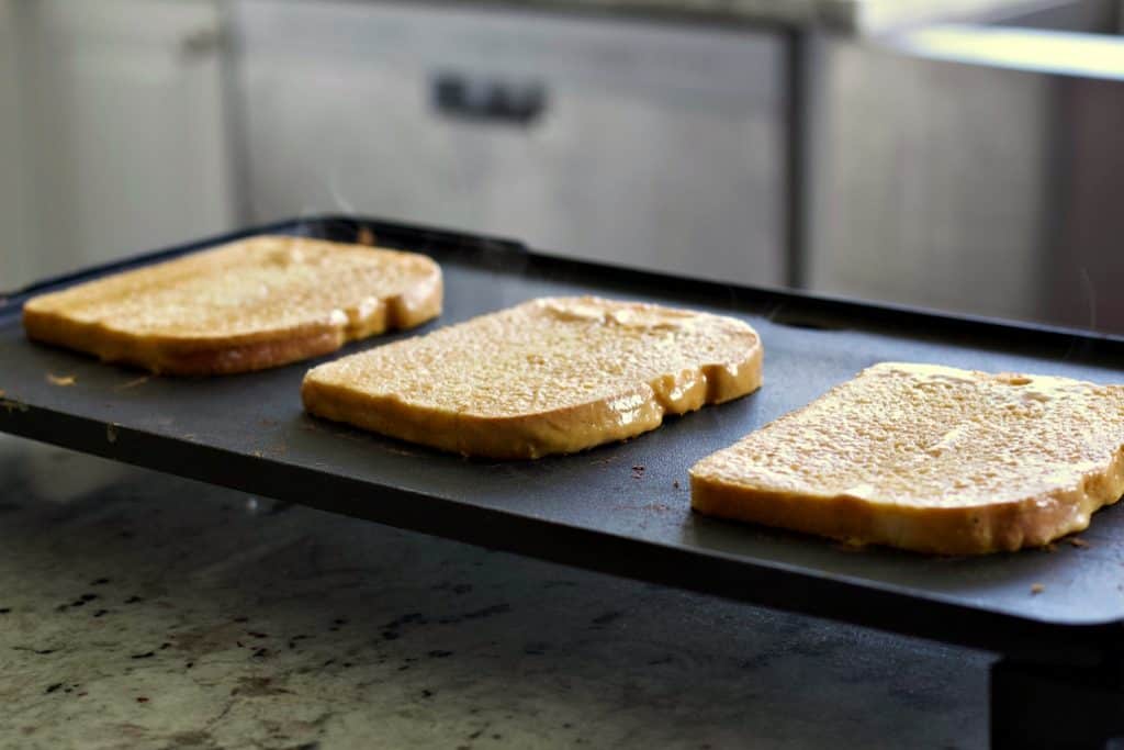 french toast cooking on a griddle