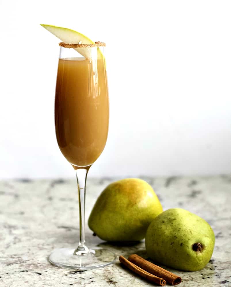 Cinnamon pear cocktail with pears and cinnamon stick