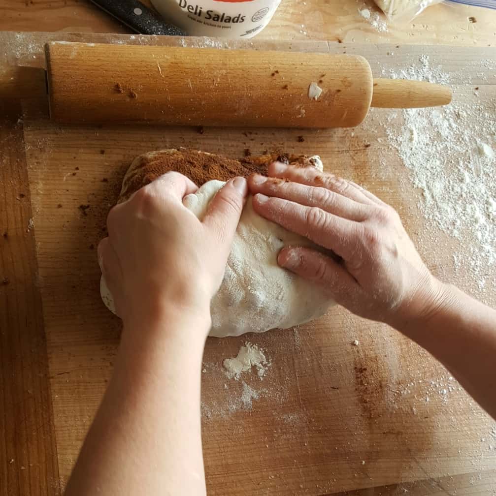 demo rolling up dough-cinnamon raisin bread