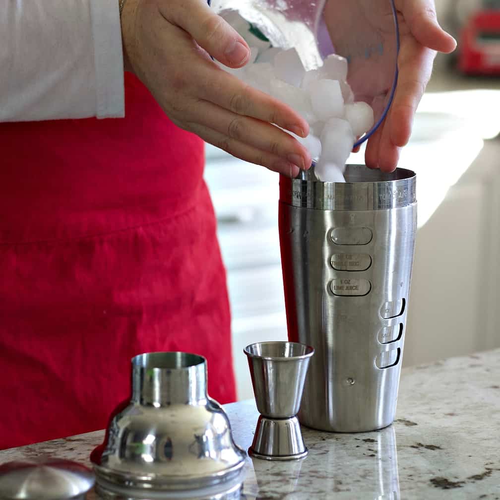 Filling the cocktail shaker with ice