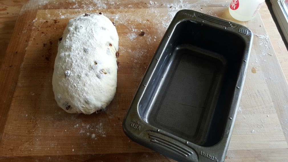 bread dough loaf and loaf pan side by side-cinnamon raisin bread