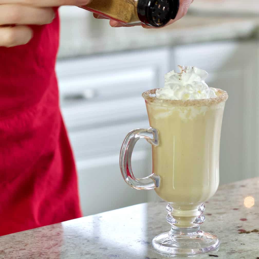 garnishing the eggnog cocktail