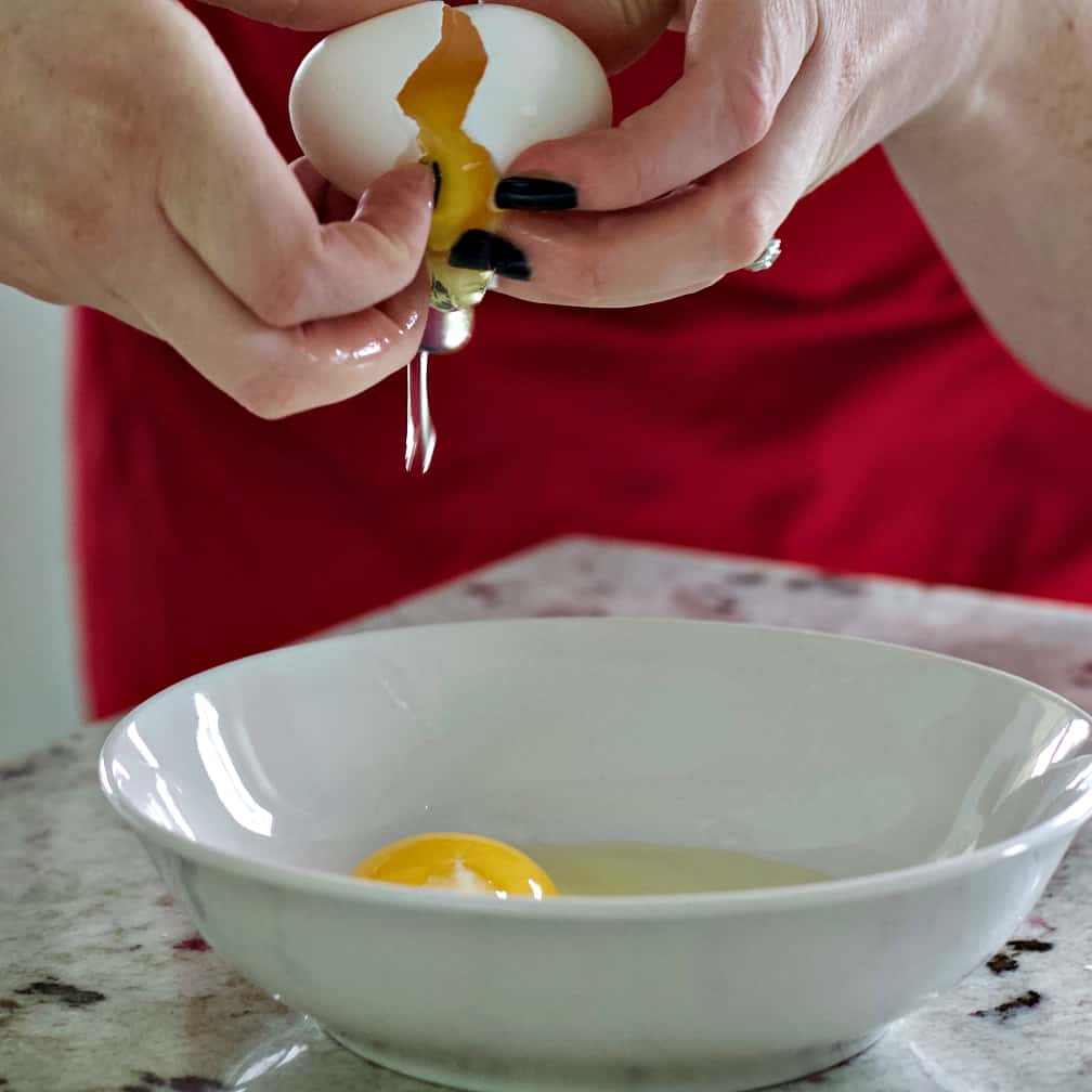 break two eggs into a bowl