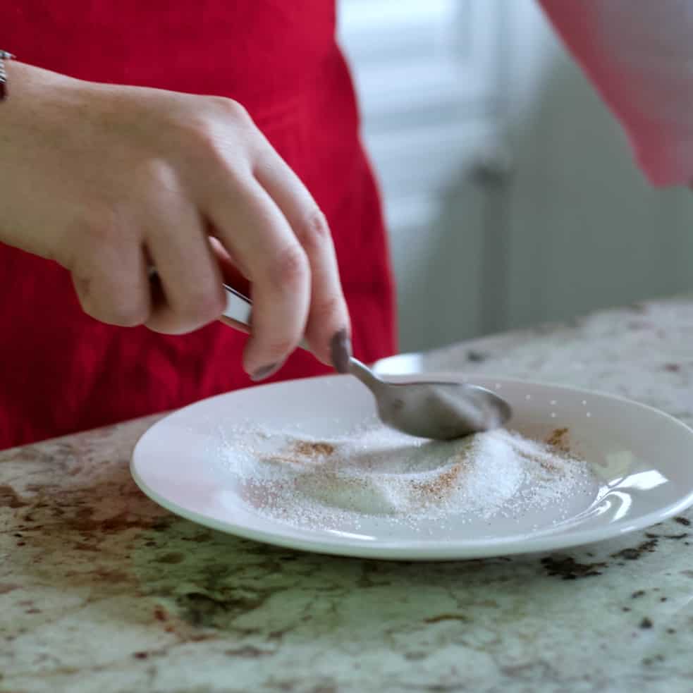 mixing cinnamon and sugar