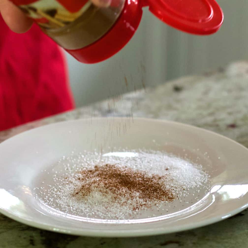 mix sugar and cinnamon on a plate