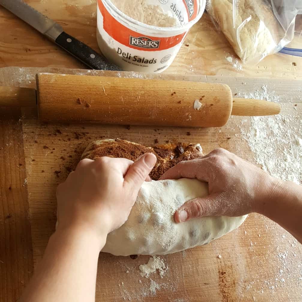 Final tuck of dough rolling-raisin bread