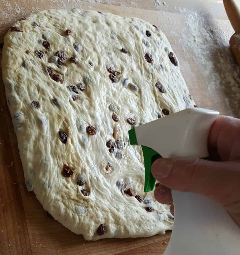 Roll the loaf out and degass and spray- Sourdough cinnamon raisin bread