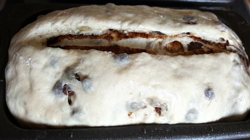 Scoring the loaf-cinnamon raisin bread