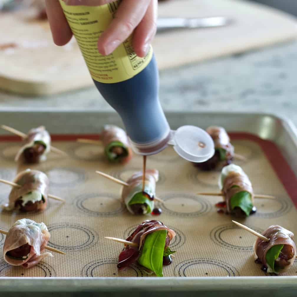 pour balsamic onto stuffed dates