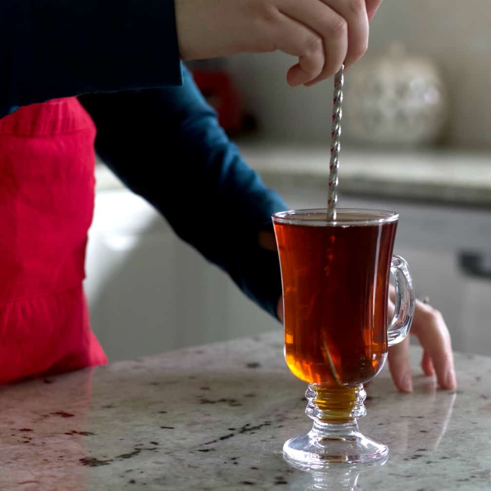 stirring the cafe amaretto