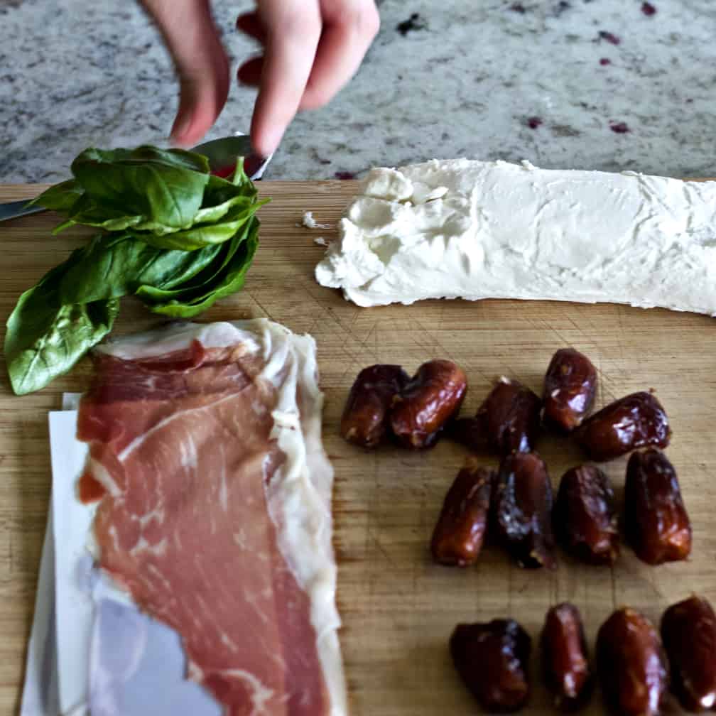 Ingredients for goat cheese stuffed dates with prosciutto and basil.