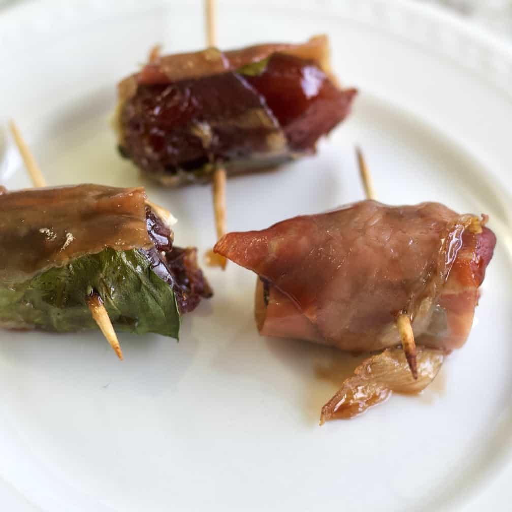 prosciutto wrapped dates with goat cheese and basil