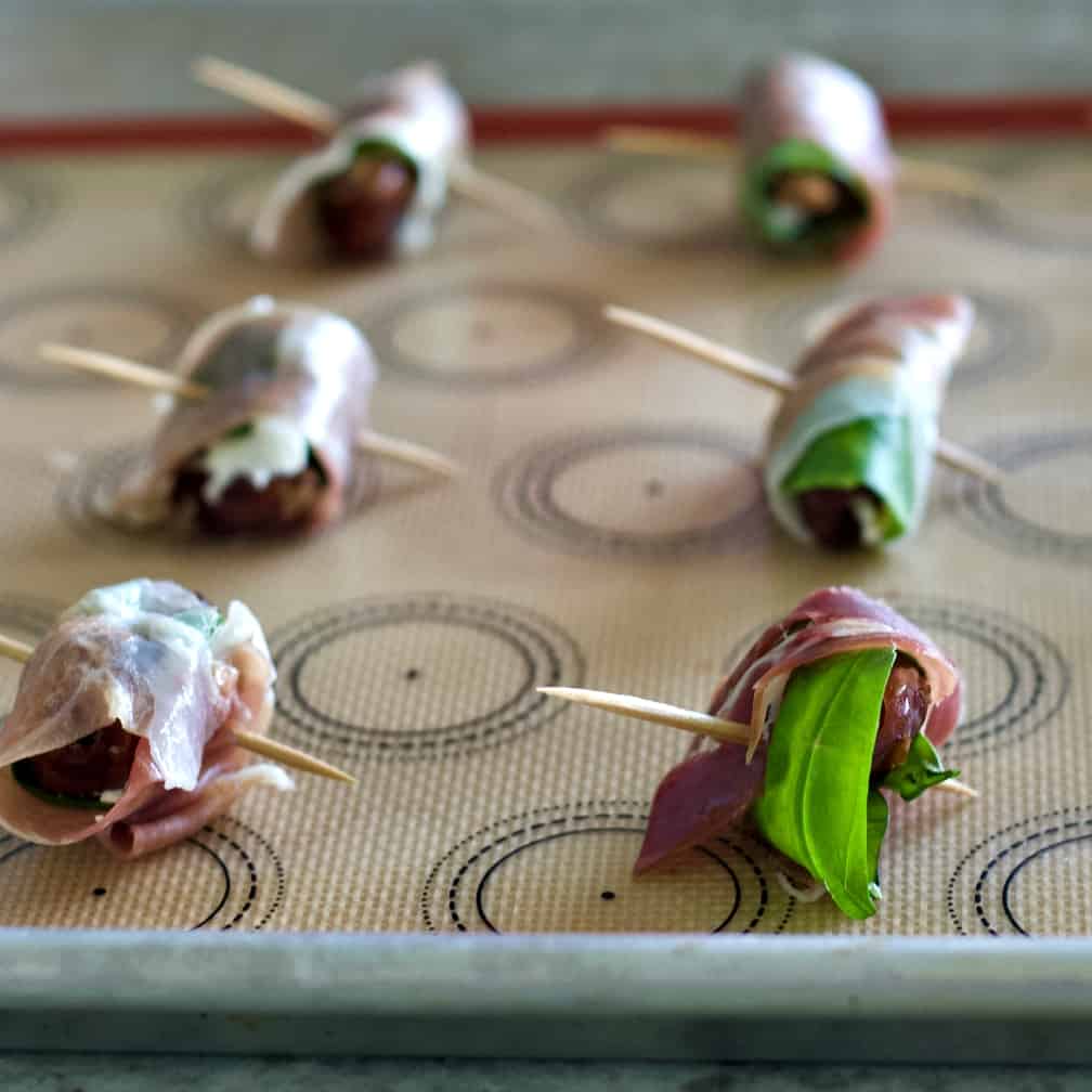 lay wrapped dates on baking tray