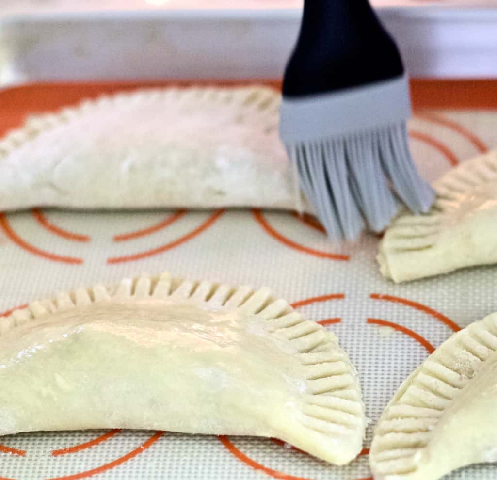 Brush the hand pies with egg wash