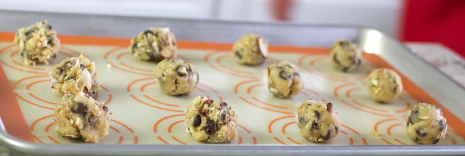 almond joy cookie dough balls on a baking sheet