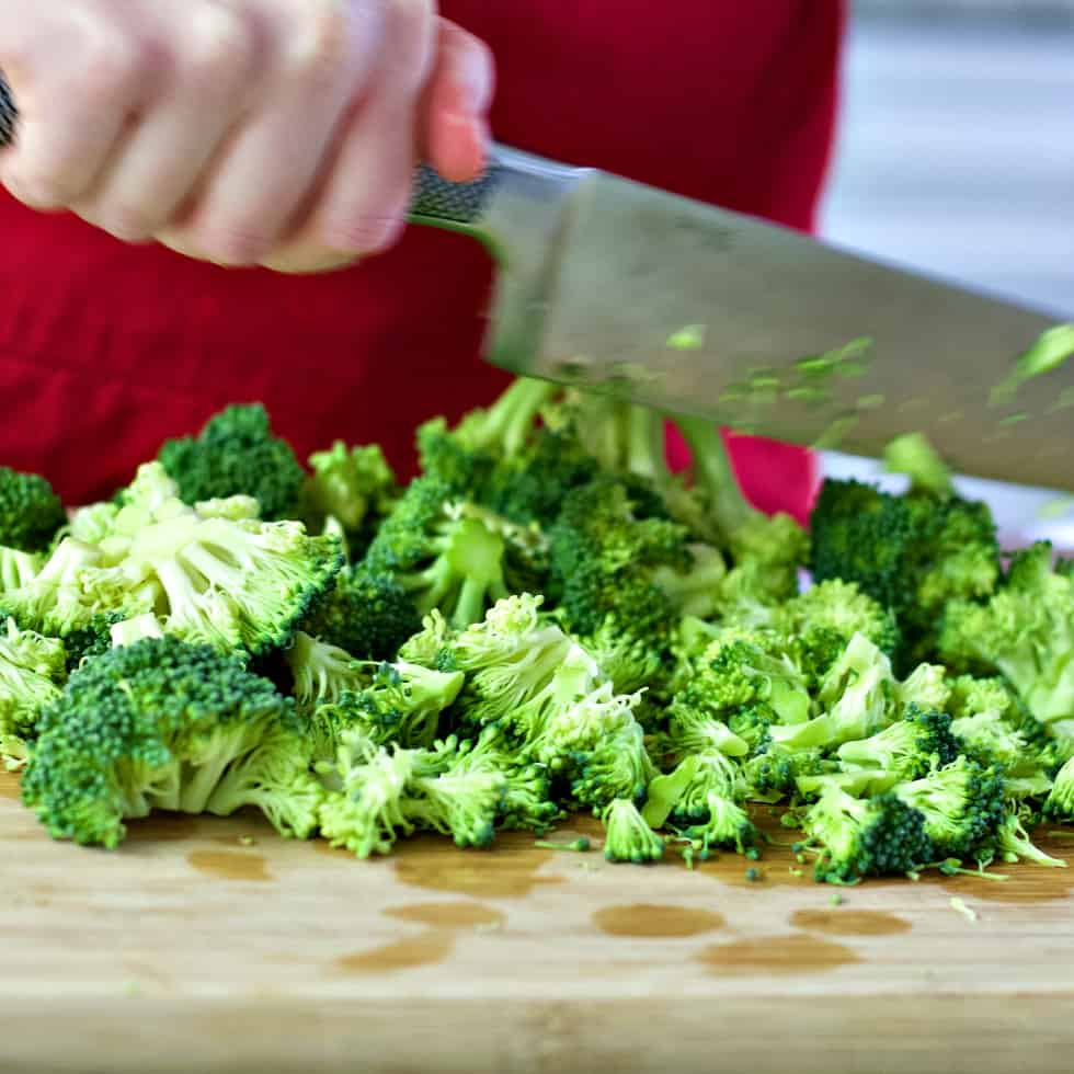 chopping broccoli for broccoli soup