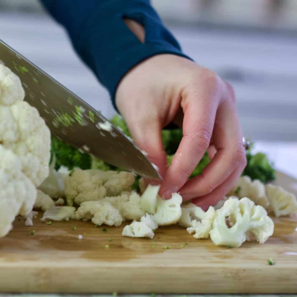 chopping cauliflower for soup