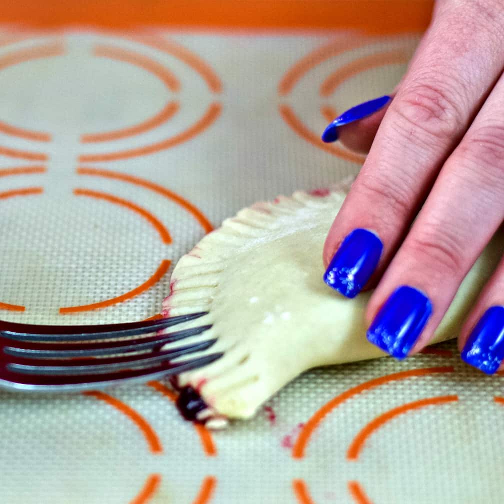crimping dough edges with a fork