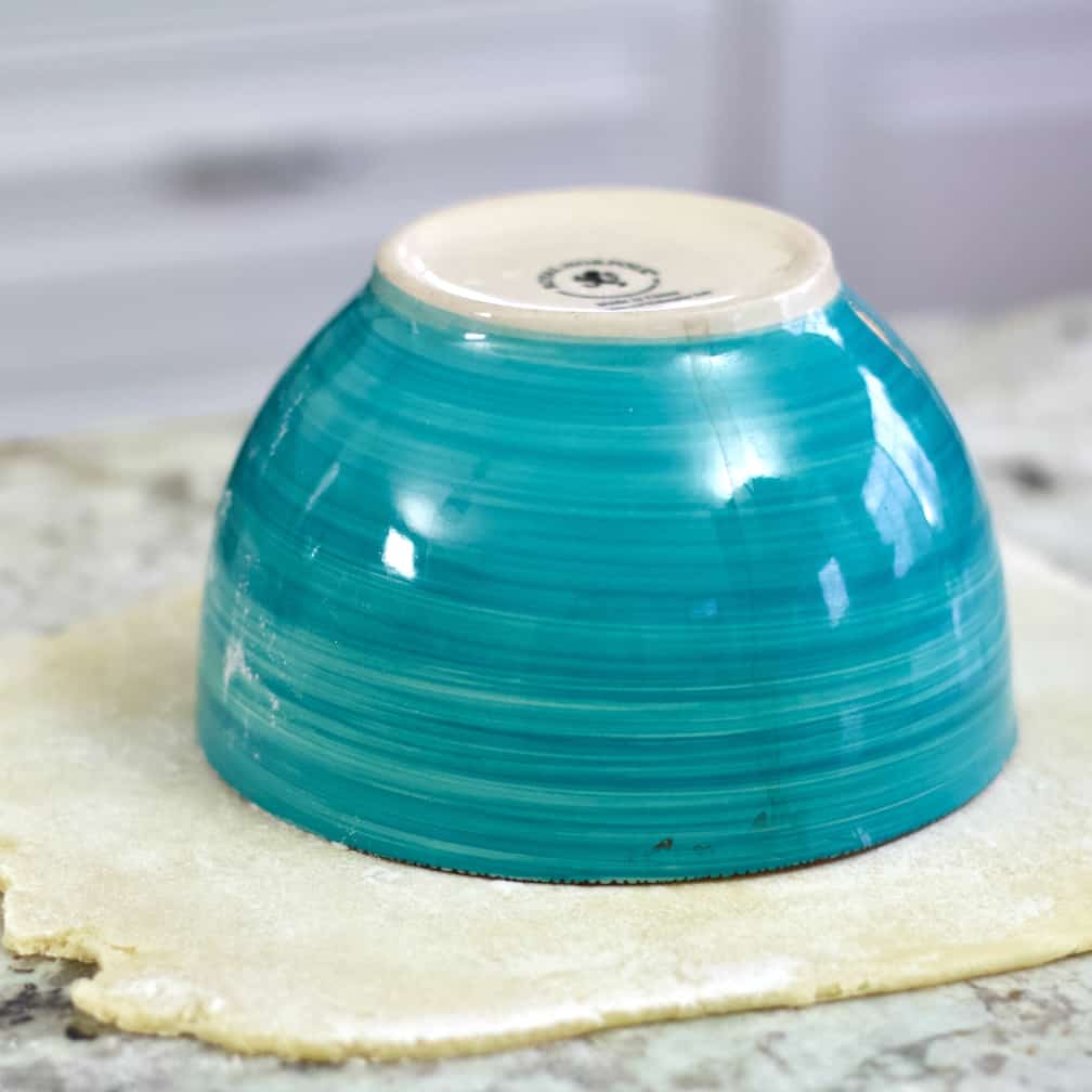 Inverted a six inch bowl on sourdough pie crust dough.