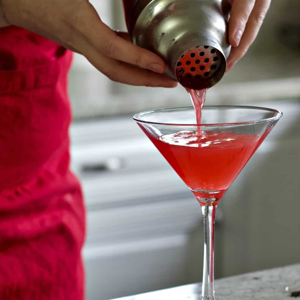 Pouring a Bacardi cocktail into a martini glass