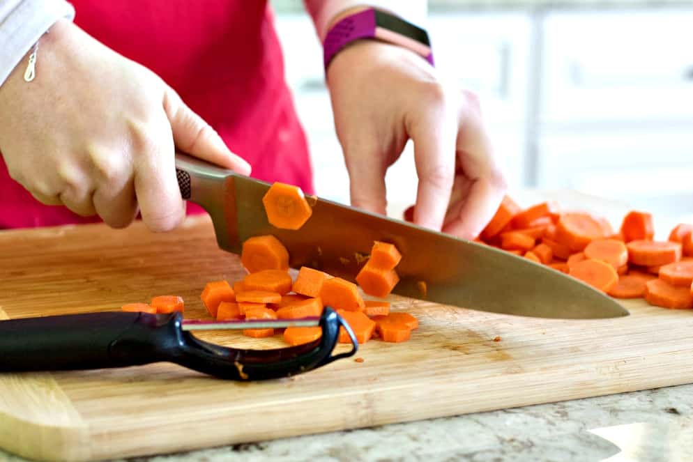 chopping carrots-rotisserie chicken soup