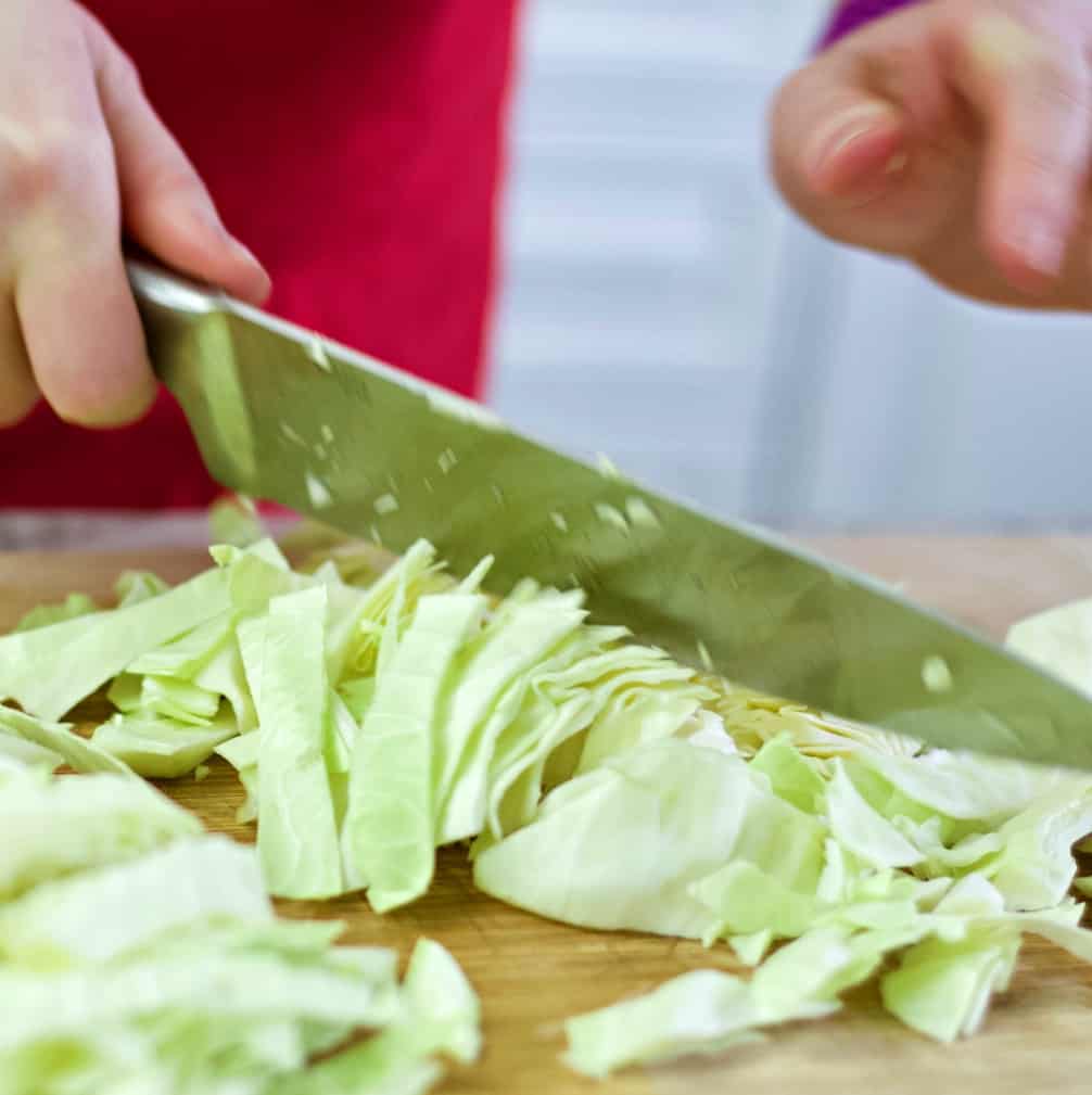 Chopping green cabbage