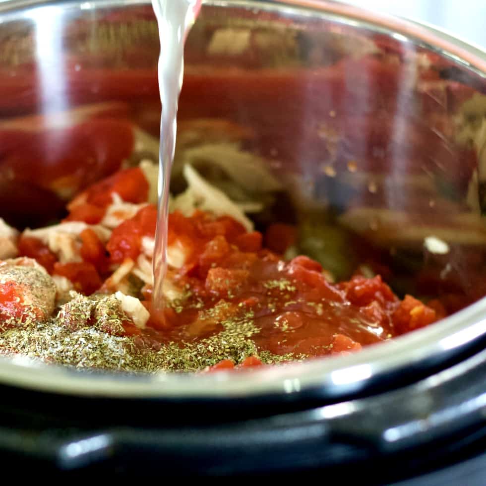 adding chicken broth to instant pot. Rotisserie chicken soup