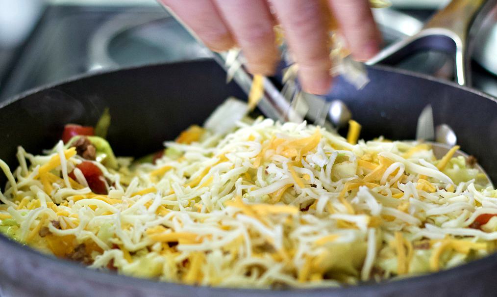 sprinkling cheese on top