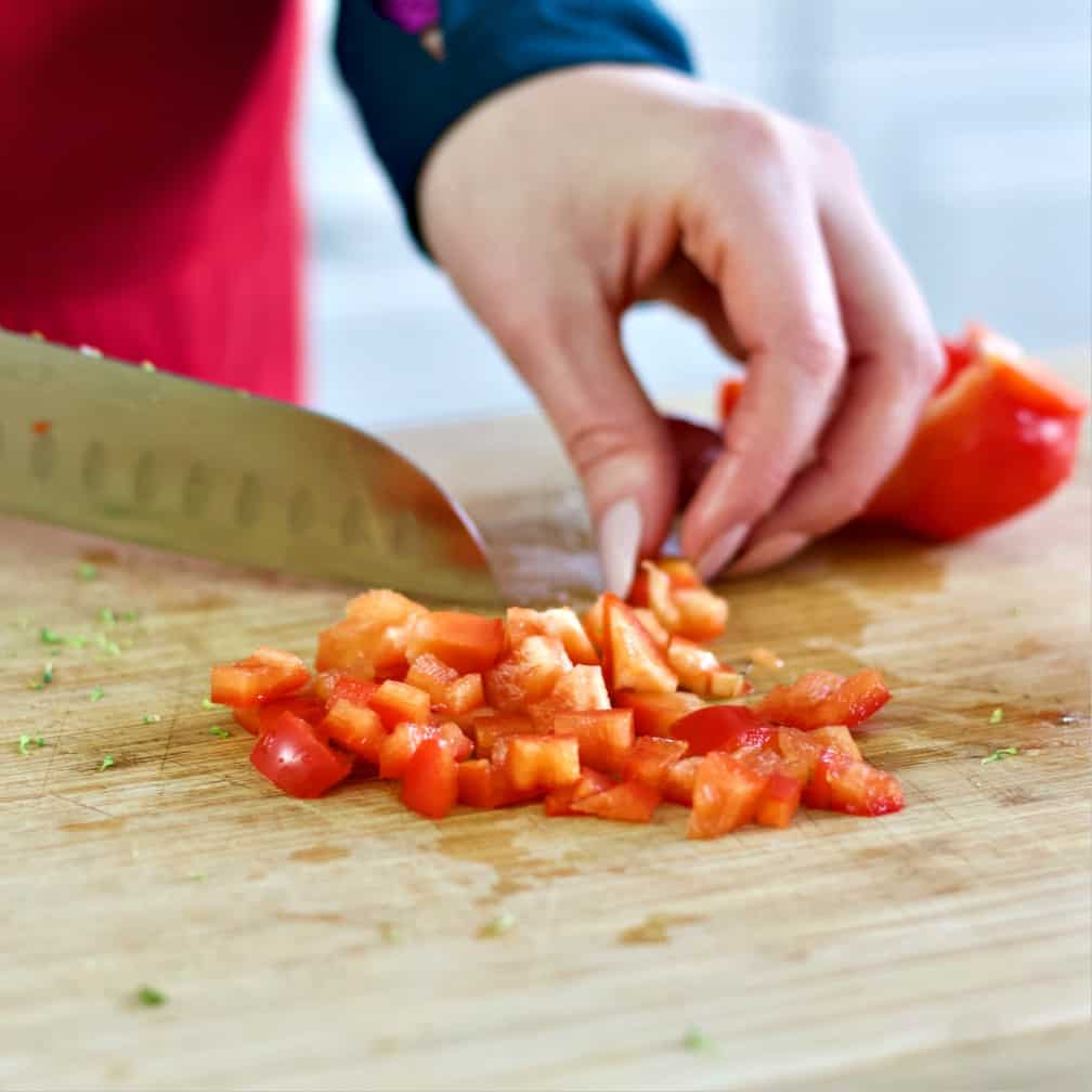 chopping a red bell pepper