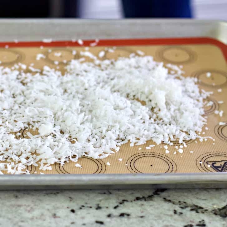 coconut flakes on a baking sheet