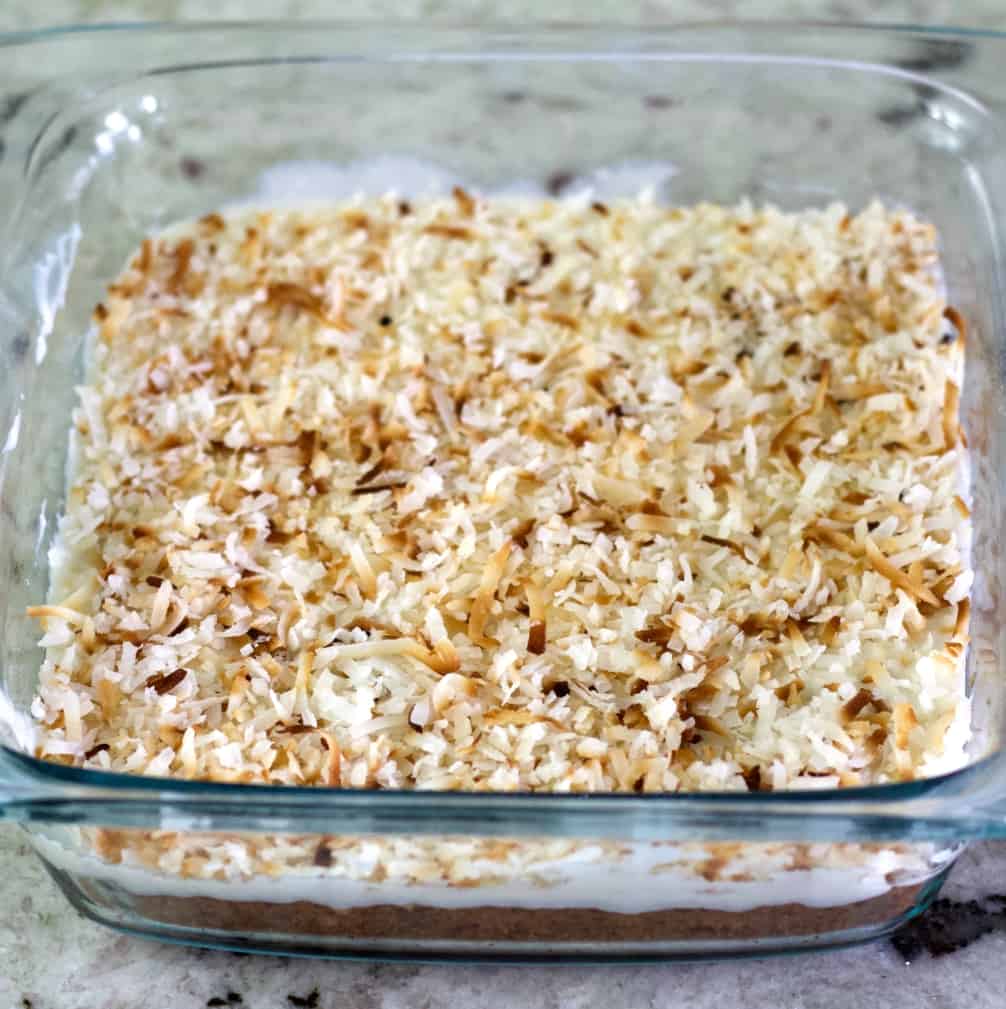 toasted coconut lemon bars in pan.