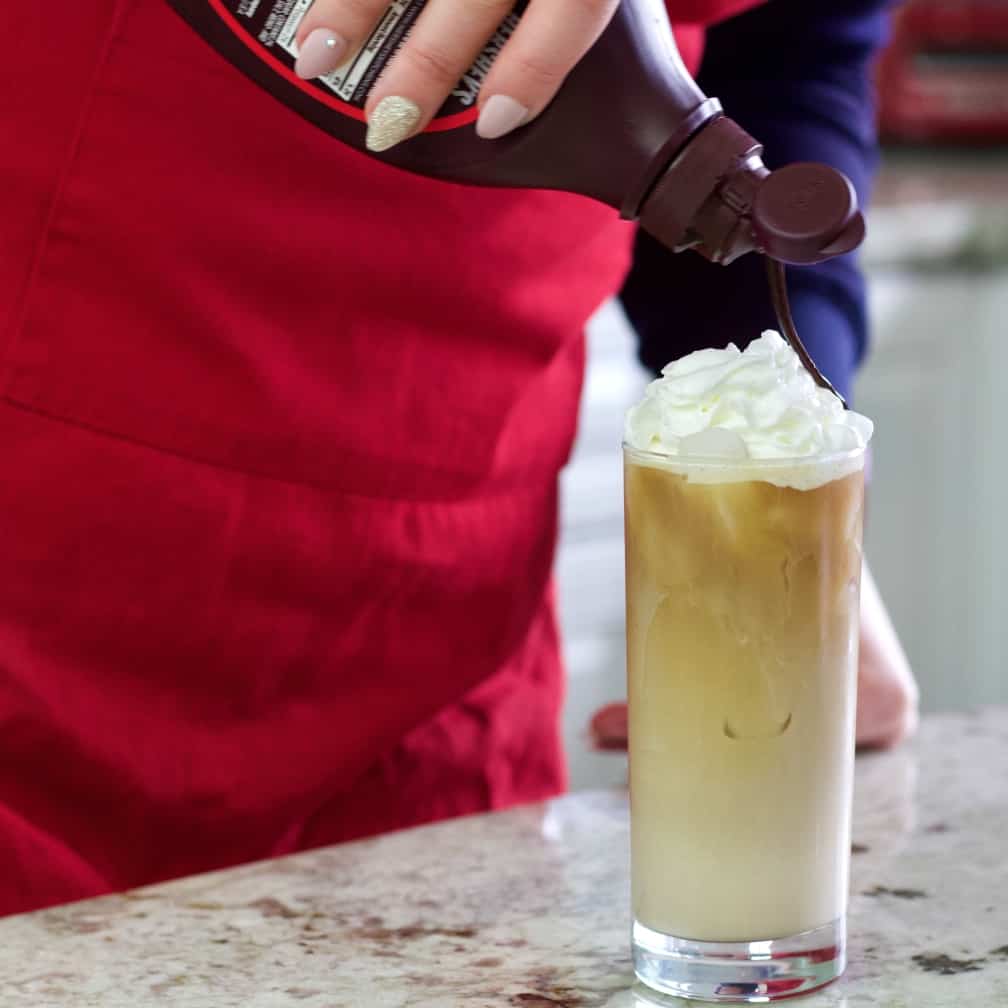garnishing with chocolate syrup-iced coffee