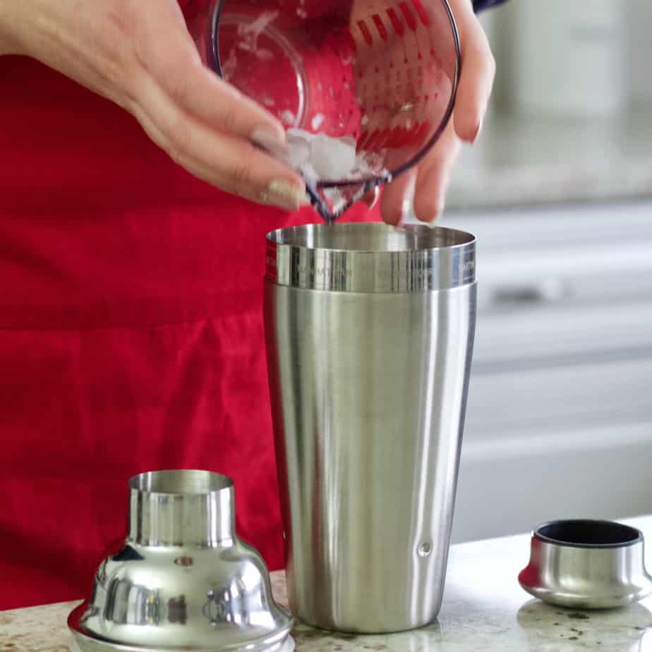 pouring ice in shaker-iced coffee