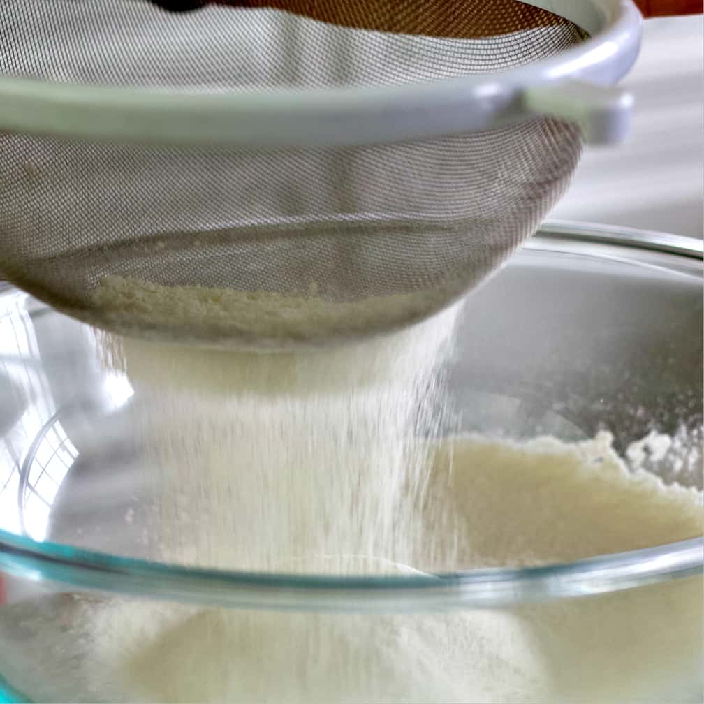 sifting dry ingredients-lemon bars