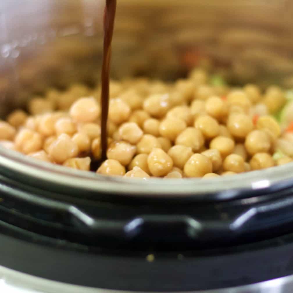 pouring Worcestershire Sauce into beans