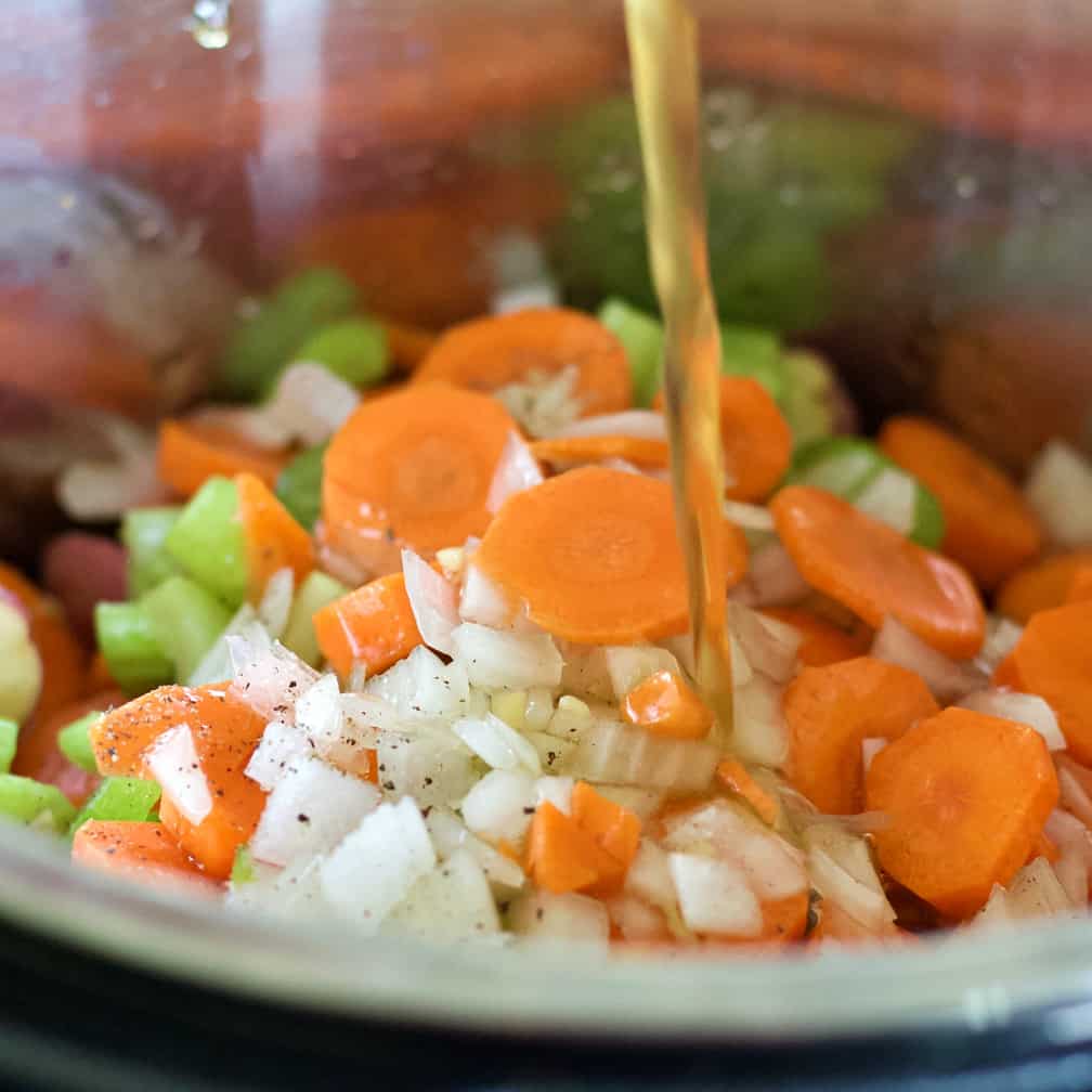 pouring beef stock-easy beef stew