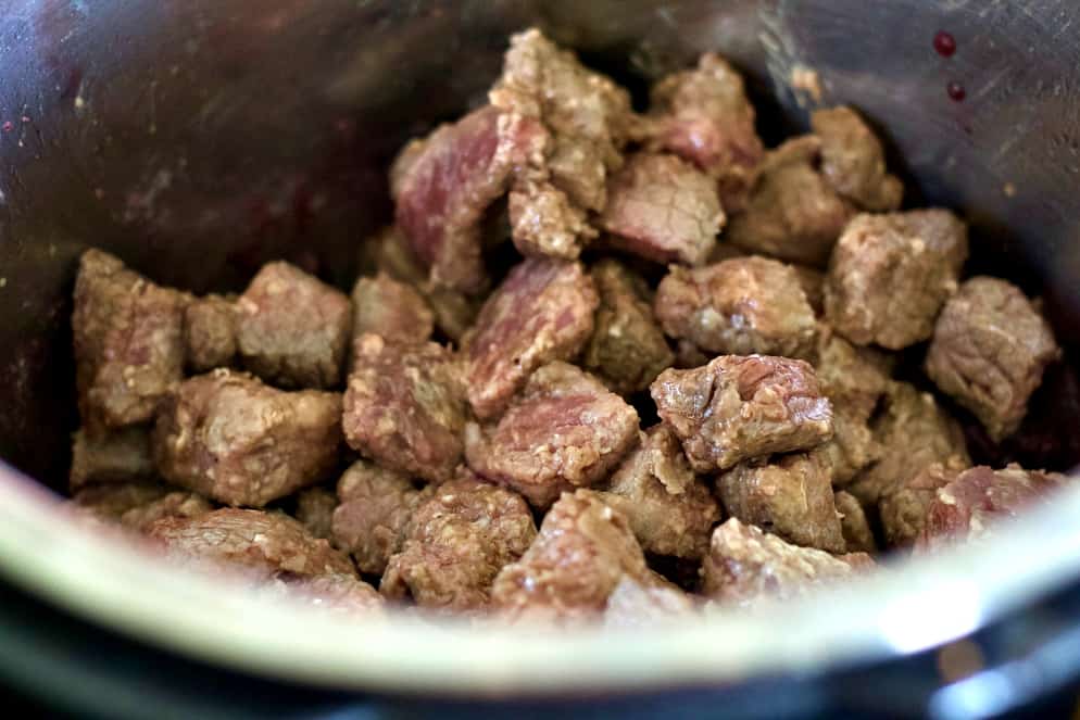 brown the coated stew meat. beef stew recipe