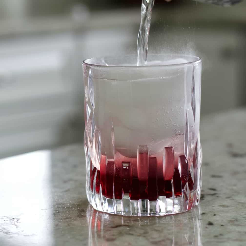Pouring Tonic into Chambord