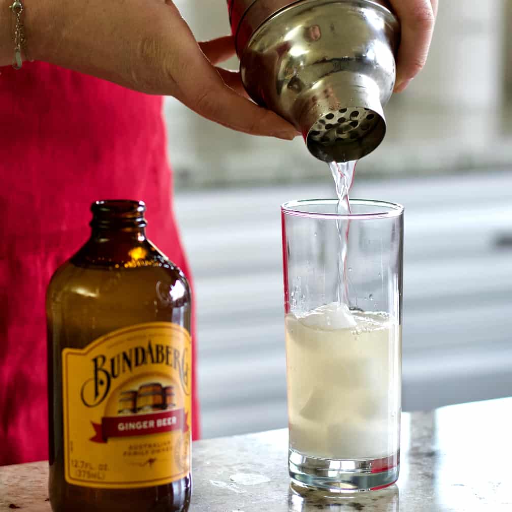 straining the cocktail