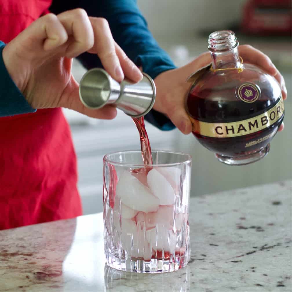 pouring chambord over ice