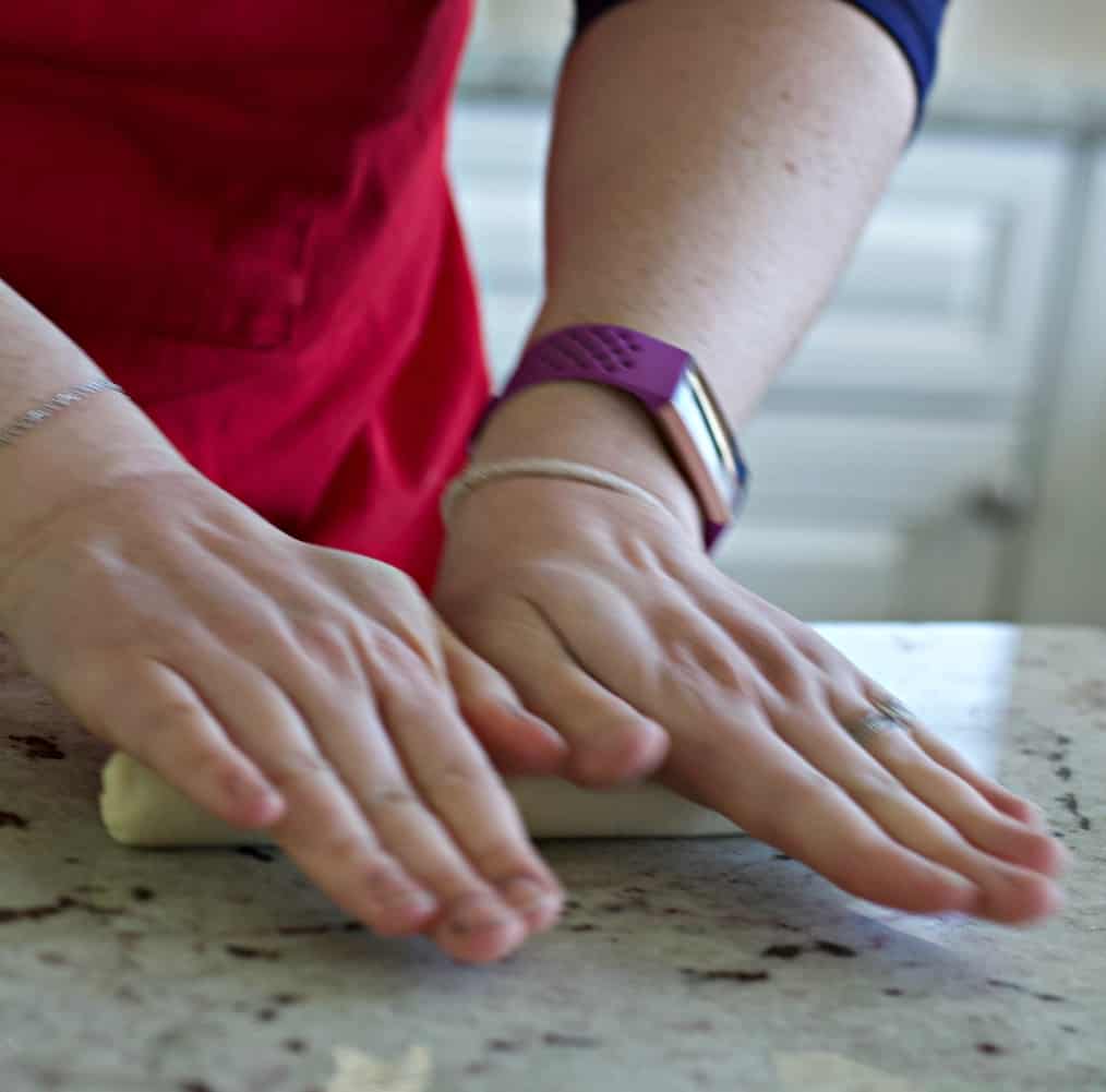 rolling bagel dough into ball.